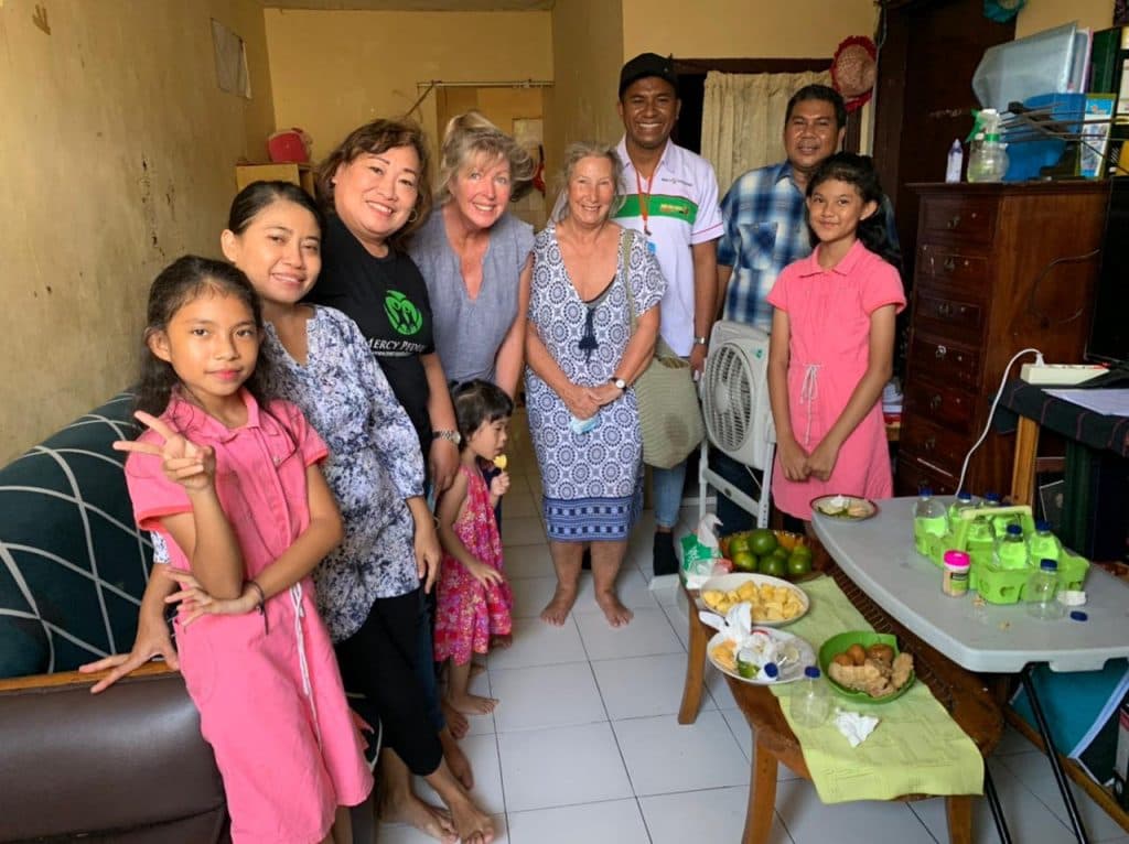 Jun 2022 Michelle with Pastor Edwuard from 2022 June Newsletter.